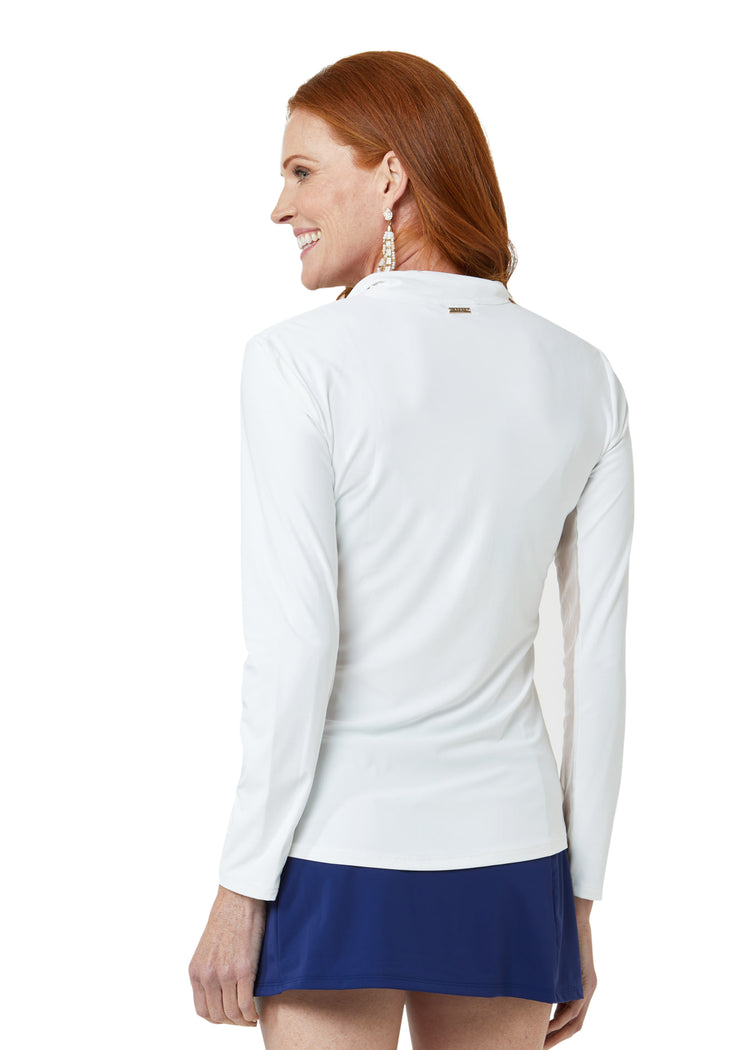 Woman wearing White Sport Zip Polo and Navy Classic Swim Skirt