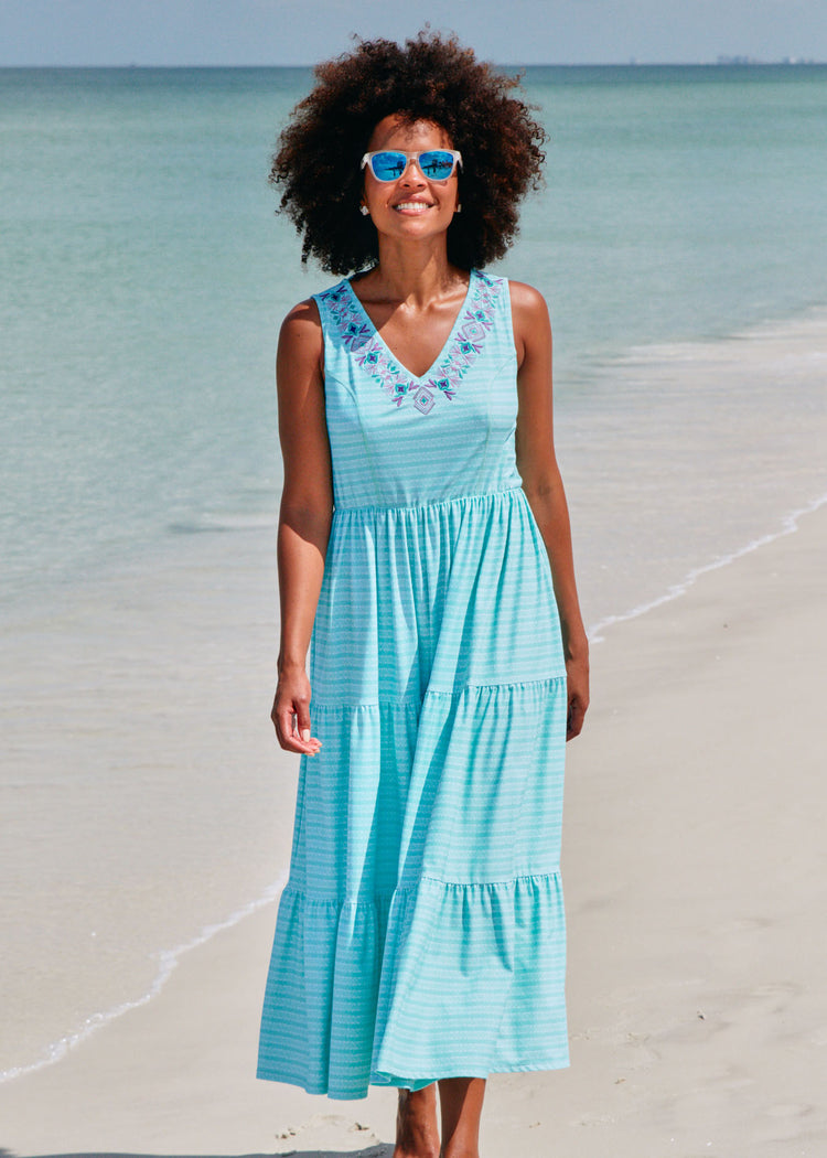 Woman on beach wearing Naples tiered maxi dress