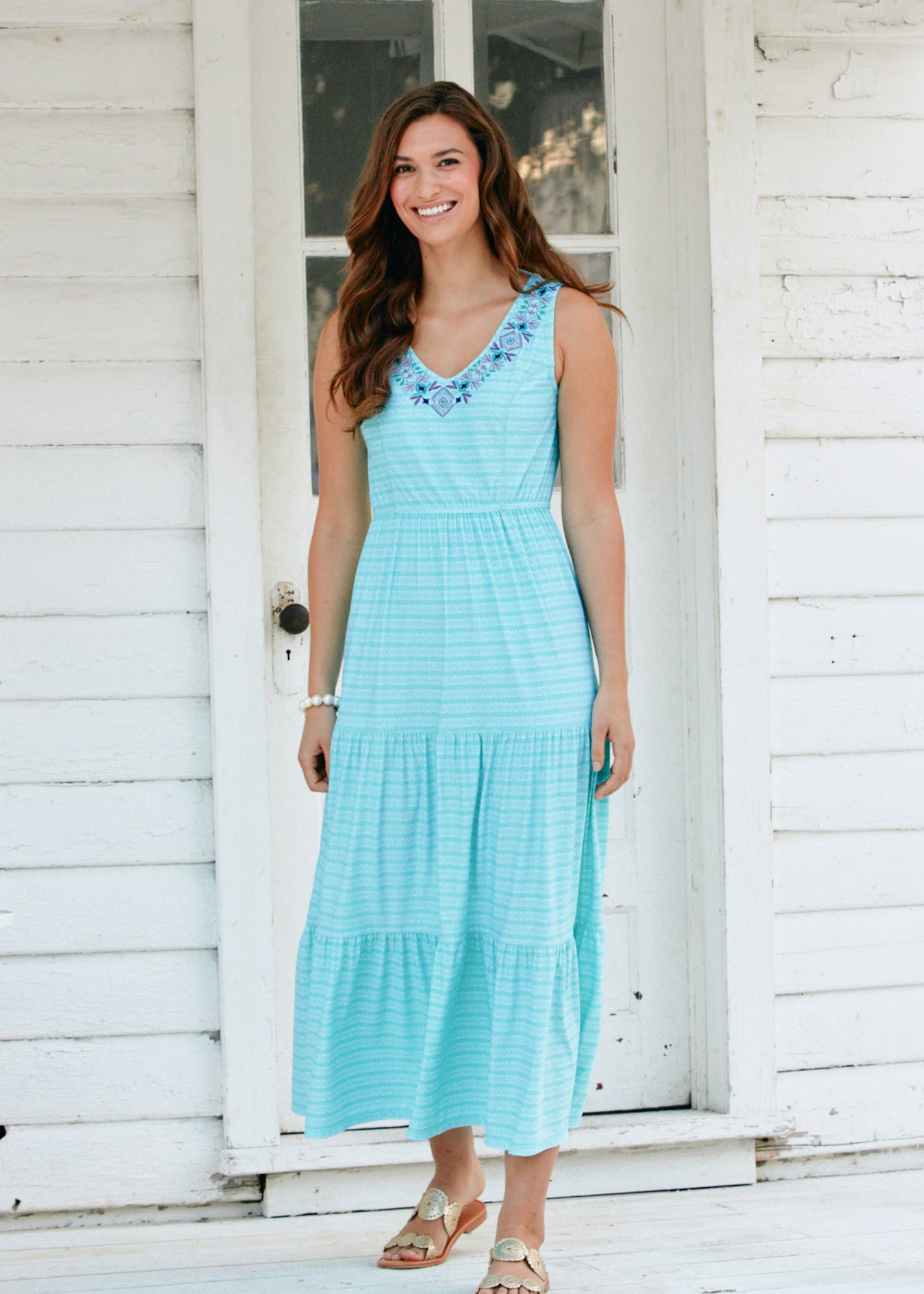 Woman wearing Naples tiered maxi dress. 