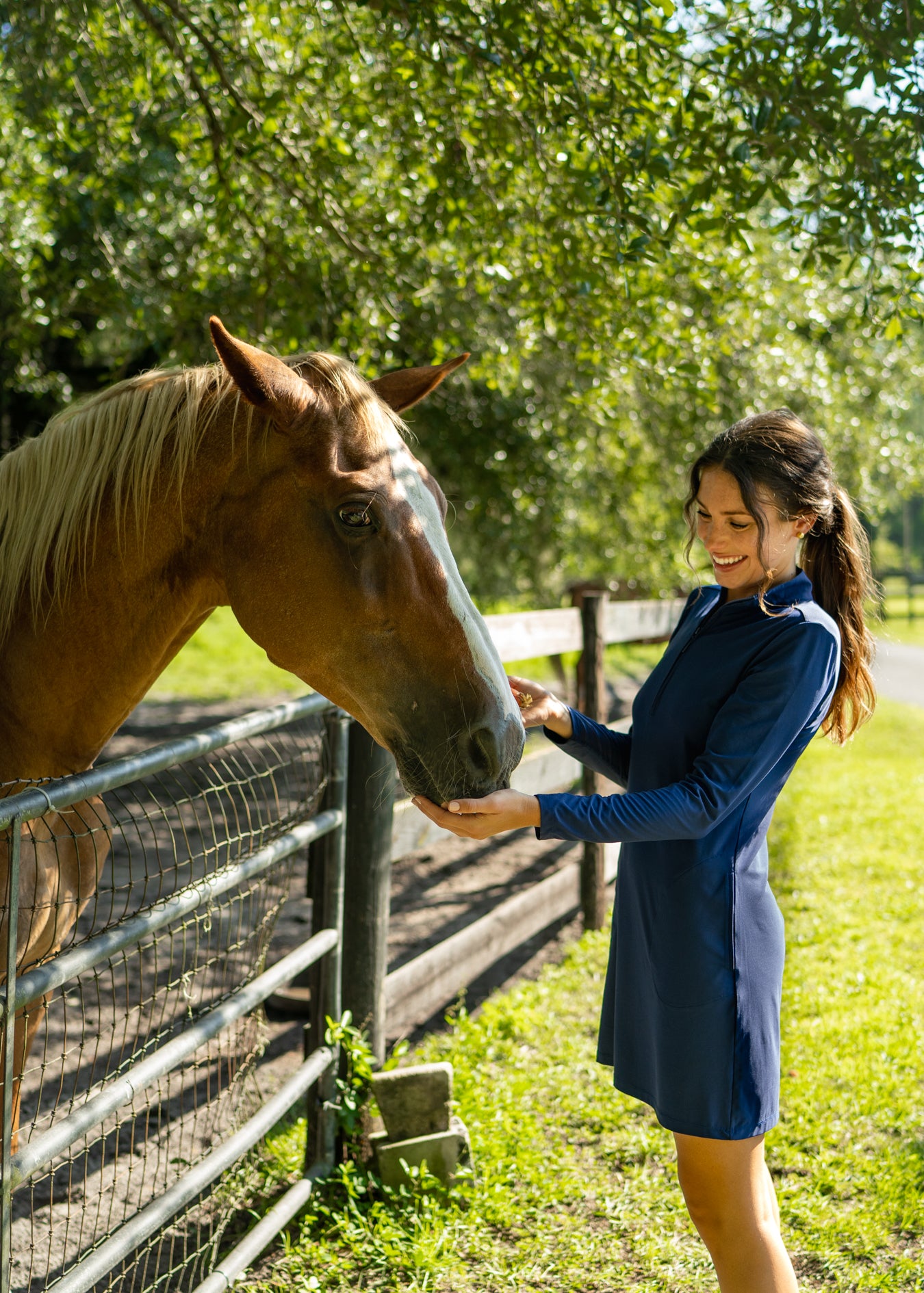 Woman wearing Navy Sport Dress with horses