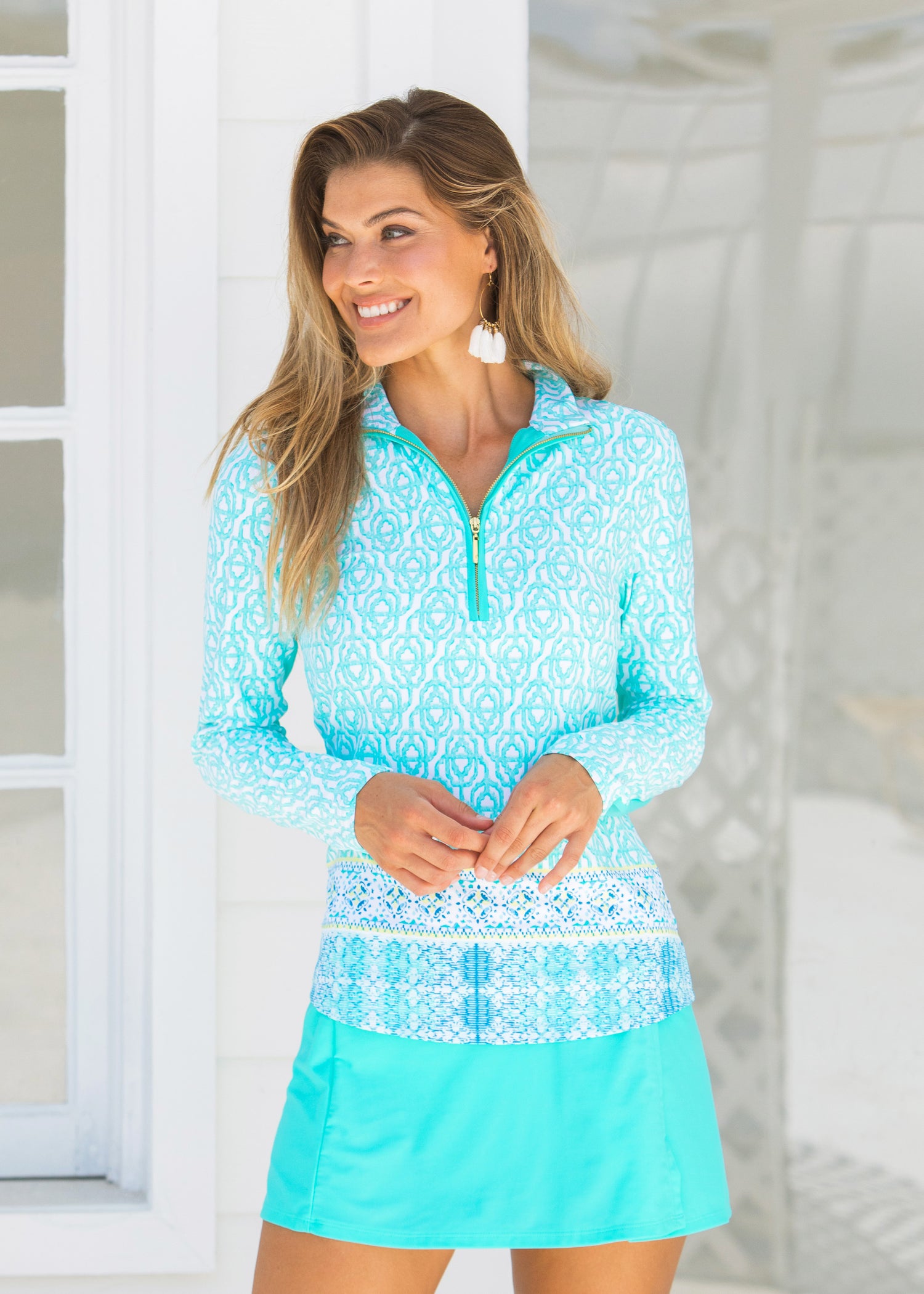Woman wearing Coastal Cottage UPF 50+ Wicking Performance Zip Top and Turquoise Longer Swim Skirt